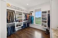 | Spacious closet with custom shelving & natural light coming in |