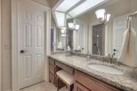 Divided bathroom offers increased space.  Sinks/vanity and closets are separated with shower room in the middle