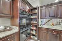 Double built-in oven and pocket cabinet for increased organization and maximizing space.