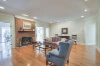 Spacious living room with brick fireplace