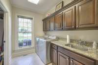 Laundry Room with large storage closet/pantry