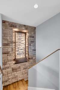 The water feature wall at the staircase if a wonderful and charming addition.