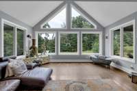 This space is wonderfully light-filled from the floor to ceiling a-frame style bank of windows.