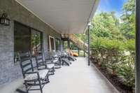 The lower level patio spans the entire back of the home and is also covered.