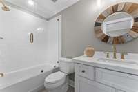 Bathroom in Bedroom 3 is tiled and has glass enclosure door