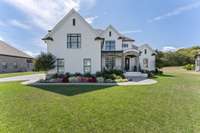 A large front porch and double door entry are very welcoming.