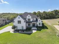 The stone water table that accents this home with exquisite finishes