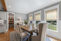 The large eat -in dining area has recessed lighting, a walk-in pantry, and overlooks the private back yard area.