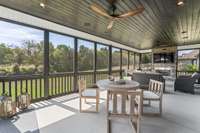 33 foot long screened porch with stoned gas fireplace is an amazing outdoor living area that steps down to a large patio.