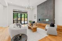 Living room, which overlooks the pool, features an impressive gas fireplace as the focal point.