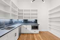 Spacious butler's kitchen/scullery with plenty of pantry storage