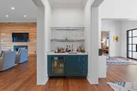 Wet-bar complete with beverage fridge and sink.