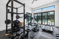 One of two rooms in the pool house is currently outfitted as a gym