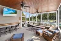 Screened in back porch overlooking pool