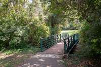 Just beyond the back of the property runs the bridge to the walking trails