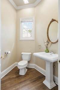 Powder room located off the side entry door to the side/back yard