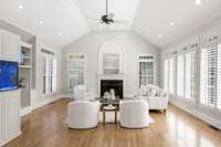 Lots of windows and light in the living area with fireplace and built ins