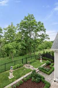 View from upper balcony. Yard is fully fenced with two gates.