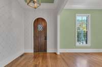 Entry foyer and formal dining room or study space.