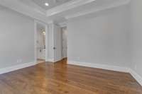 One of three upstairs bedrooms. Includes ensuite bathroom with tiled shower, extra-large walk-in closet, and additional cedar closet.