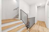 Second floor stairs leading to third floor. This floor also has two linen closets in the hallway.