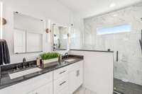 Oversized shower, double vanities.