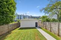 Poured concrete walk when garage was constructed in 2022.  7ft fencing