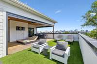 Covered and uncovered 3rd floor space. Artificial turf over outdoor space.