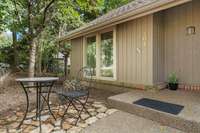 This little stone patio off the front of the house is a great spot to watch the sunrise in the morning or chat with the cul-de-sac neighbors. Only one step in from the driveway!