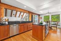 A view of the main area of the home from the prep island, sink and stove keeps you involved with the party, even when you're cooking for a crowd