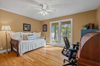 This Guest Bedroom is currently used as a Home Office and occasional Guest Room and overlooks the backyard and cove