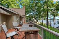 The Primary Bedroom has its own entrance to the deck just to the left