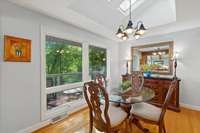 This large Breakfast area is bright with vaulted ceilings with skylights