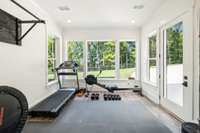 This sunroom has been used as an art studio and currently as a gym.