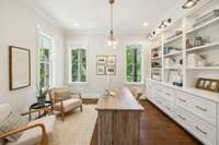 Beautiful built-in bookcases with sconces.