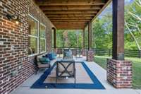 Covered basement patio below the screened in porch.