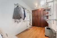 The Primary closet features built-ins with pull-out shelving too!