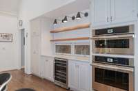 The built-in appliance garages may be a favorite detail in this custom kitchen design...Note also the double ovens and wine refrigerator - built in pantry on opposite side.