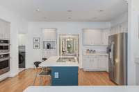 So much storage in this kitchen - no detail was overlooked.  Note the coffee bar to the left of the doorway here!