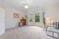 The second upstairs bedroom is currently used as an office and features a bay window.