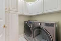 The laundry is just off the kitchen and offers lots of storage!