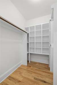 A large primary walk-in closet.