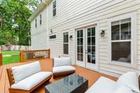 As you walk outside, you have an amazing large deck for hosting parties or drinking your coffee in the morning!