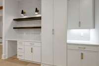 Photos are not actual home but finishes are very similiar. Double doos to hidden pantry