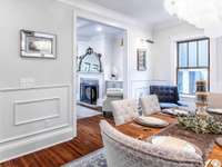 Formal dining area and a fixture to brag about!  Love the art mirrors and box trim feature walls.