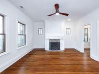 Upstairs front bedroom with fireplace, outdoor porch, walk-in closet and attached full bath