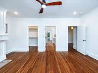 Upstairs front bedroom with fireplace, outdoor porch, walk-in closet and attached full bath