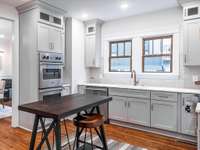 Spacious kitchen with Viking appliance package, marble countertops, custom vent hood, walk-in pantry, and coffee nook that will definitely spark a conversation!