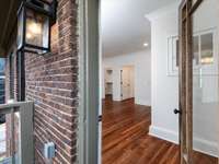 Upstairs front bedroom with fireplace, outdoor porch, walk-in closet and attached full bath