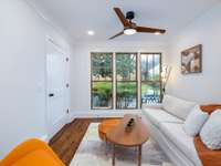 Love this cozy den/sunroom that overlooks the spacious backyard!  Great place to sip coffee or wine and take in the beautiful scenery the magnolia tree provides.